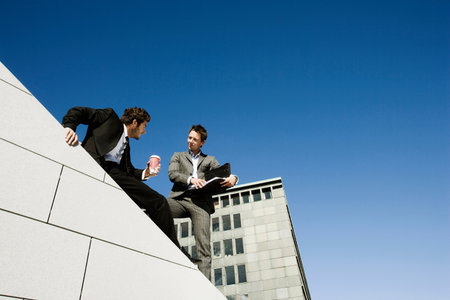 Men doing business on roof