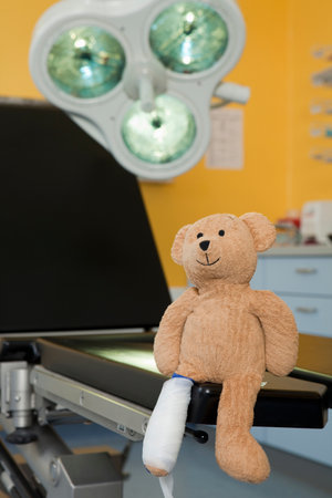 Teddy bear with dressing at couchの写真素材
