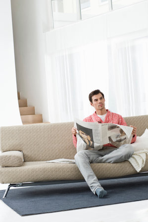 Man reading newspaperの写真素材