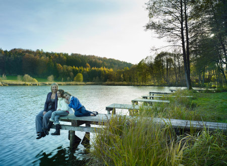 Family enjoying autumnal atmosphereの写真素材