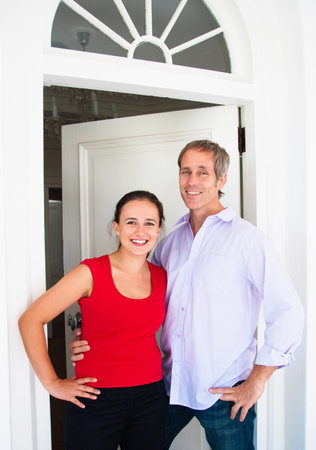 Couple outside their homeの写真素材