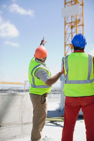 Workers inspecting a building plot