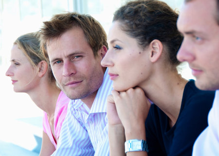 Portrait of businessman in line upの写真素材