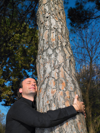 Man hugging a tree