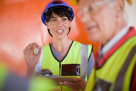 Female architect talking to builders