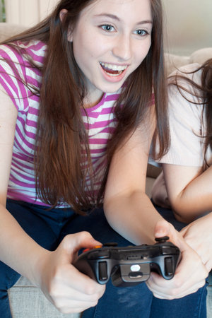 teenage girl playing a video game