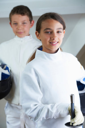 Children wearing fencing costumesの写真素材