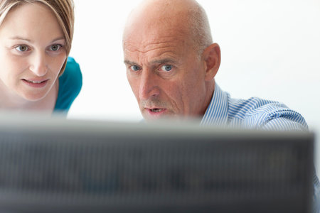 Business people using computer in officeの写真素材