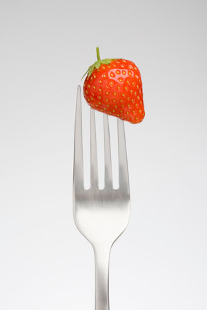 Close up of strawberry on fork