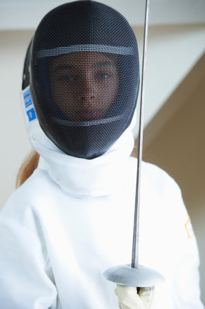 Girl in fencing costume holding sword