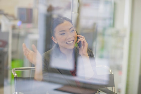 Businesswoman talking on cell phoneの写真素材