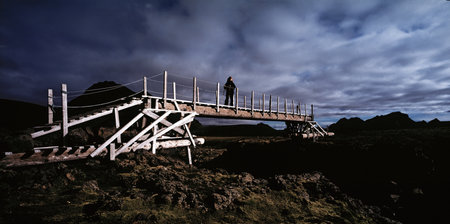 Woman on wooden bridgeの写真素材