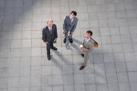 Business people talking in courtyardの写真素材