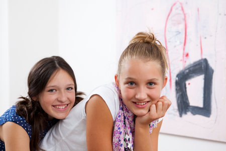 Smiling girls huggingの写真素材