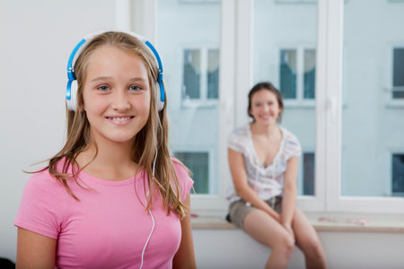 Smiling girl listening to headphonesの写真素材