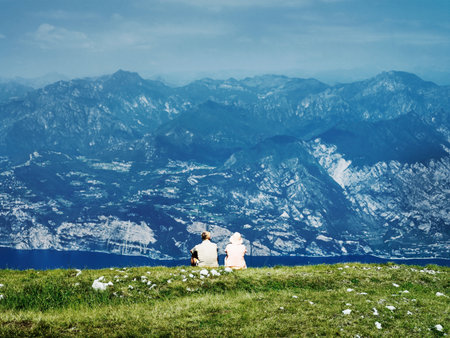 Couple sitting on rural hillsideの写真素材
