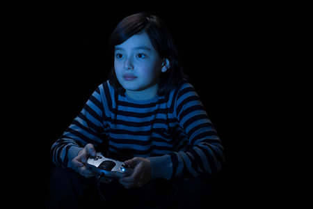 Boy playing video gameの写真素材