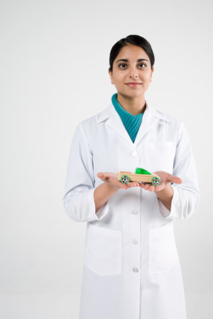 Scientist with toy carの写真素材