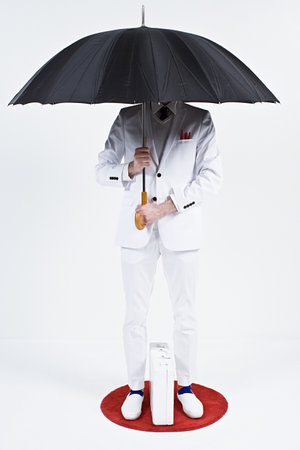 A businessman holding an umbrellaの写真素材