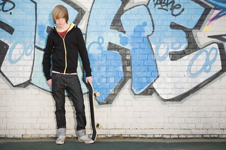 Teenage boy with skateboardのeditorial素材