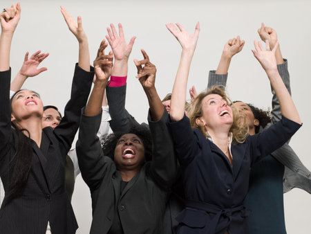 Businesswomen with arms raisedの写真素材