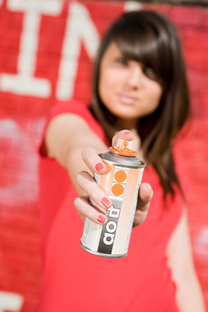 Girl with spray paintの写真素材