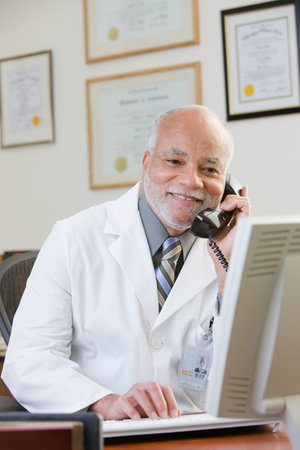 A doctor using the phoneの写真素材