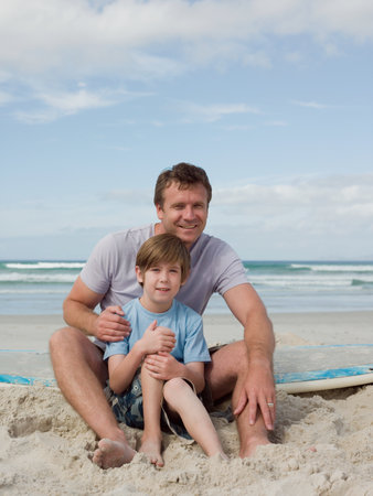Father and son on beachの写真素材