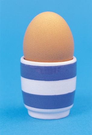 Egg and cup background.の写真素材