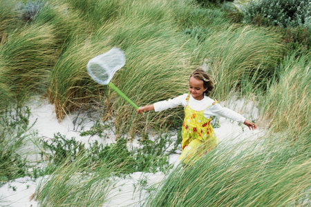 Girl with a butterfly netの写真素材