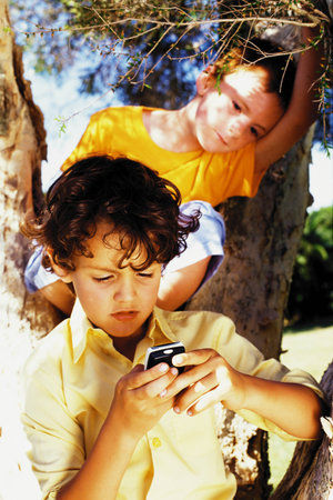 Boys with a mobile phoneの写真素材