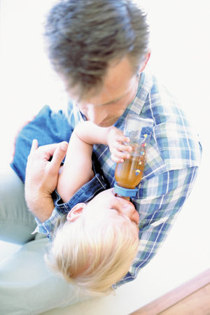 Father feeding toddlerの写真素材