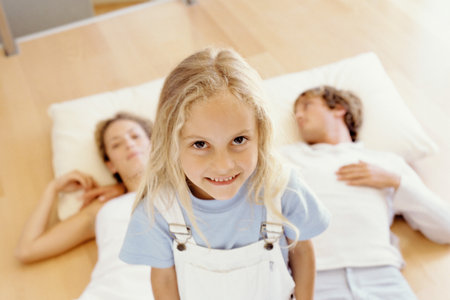 Girl with her mother and fatherの写真素材