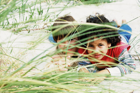 Boys playing hide-and-seekの写真素材