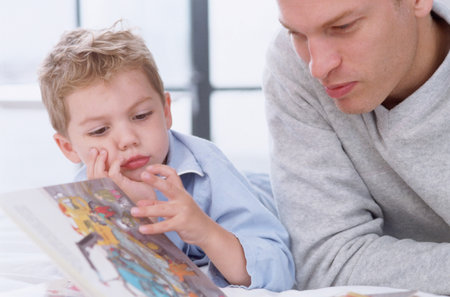 Father and son readingの写真素材