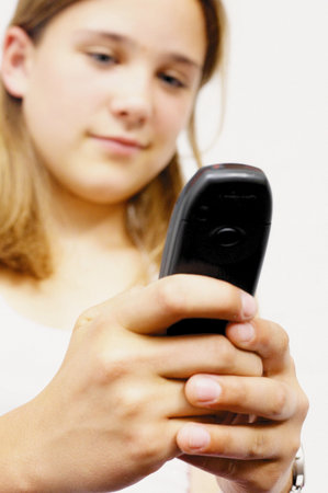 Teenage girl with mobile telephoneの写真素材