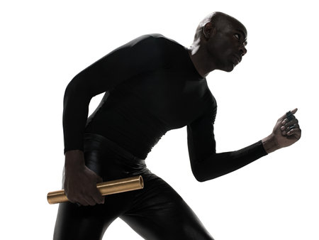 Young man holding a relay batonの写真素材