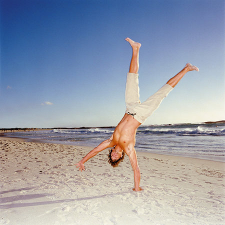 Man exercising on beachの写真素材