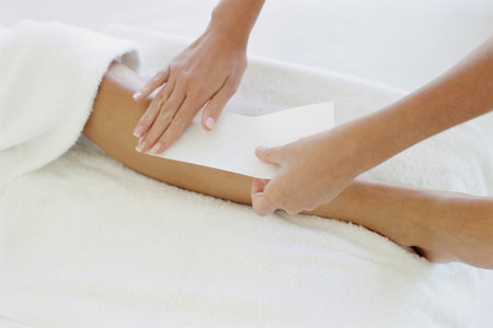 Woman being waxedの写真素材