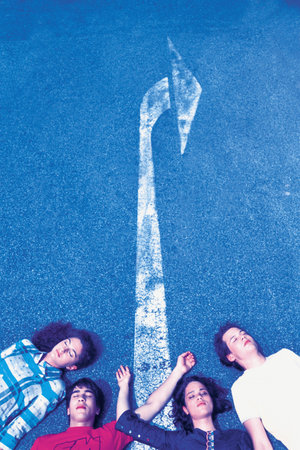 Four people lying on roadの写真素材