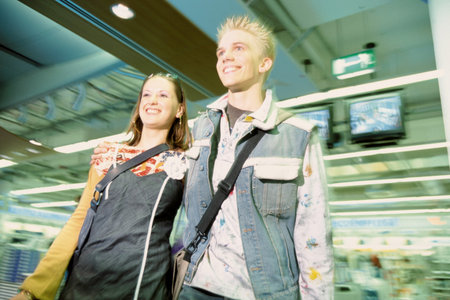 Teenage couple shopping