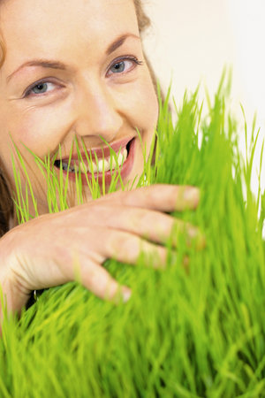 Woman touching grassの写真素材