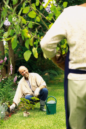 Couple in a gardenの写真素材