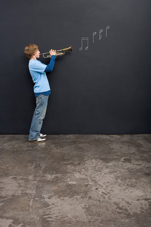 A boy playing a trumpet