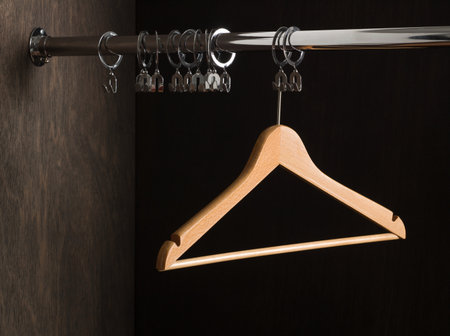 Empty clothes hanger in closetの写真素材
