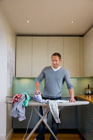 A house husband ironingの写真素材