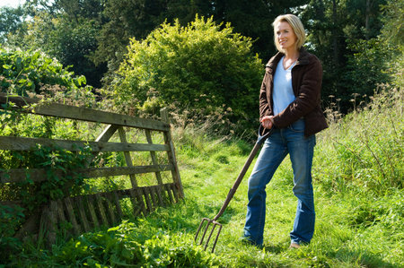 Woman with pitchforkの写真素材