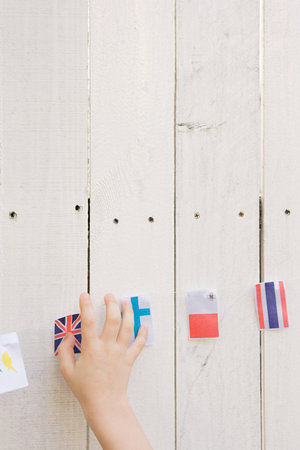 Childs hand and flags