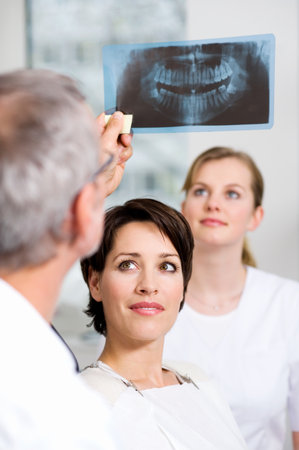 Dentist with patients x-rayの写真素材