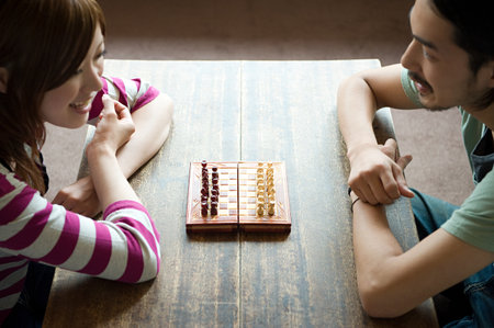 Young couple playing chessの写真素材